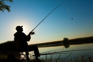 Old- Man - fishing -in -lake -in evening